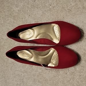Red faux suede pumps